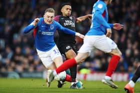 Pompey's Ronan Curtis in action against former team-mate and Peterborough defender Nathan Thompson last season. Picture: Joe Pepler