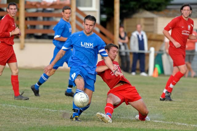 Gary Austin (blue) in action for Fareham Town at Horndean in 2010. Picture: Steve Reid