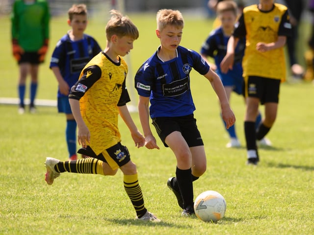 Action from the Clanfield youth football tournament at Horndean Technology College. Picture: Keith Woodland (270521-457)