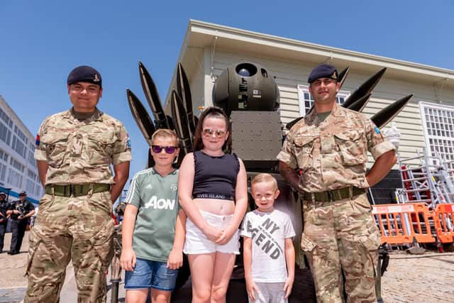 16th Regiment 11 Battery Lance Bombardier Cook and Sgt Barker-Magowan with Ray Underwood, nine, Scarlet Swinto, 10, and Reegan Swinton, five, and the Rapier FSC Launcher during Armed Forces Day in Portsmouth last year
Picture: Vernon Nash (290619-019)