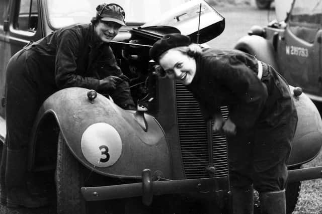 Members of the women's branch of the Auxiliary Territorial Service (ATS) fixing a car in Portsmouth during the Second World War.