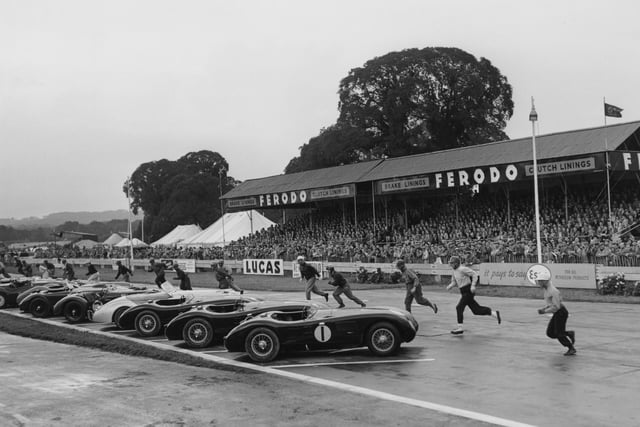 Drivers running to their cars at the start of the 9-hour International Sports Car Race at the Goodwood Circuit, West Sussex, 16th August 1952. The competitors include Stirling Moss (far right) and Tony Rolt (1918 - 2008, second from right). (Photo by Don Price/Fox Photos/Hulton Archive/Getty Images)   