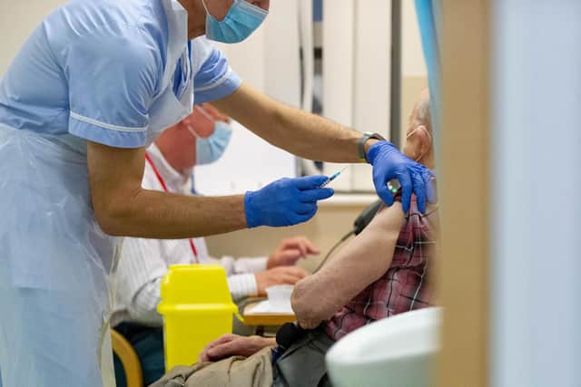 A patient receiving a vaccination at Fareham Community Hospital. New tiers come into force today because of a coronavirus variant that spreads more quickly
Picture: Habibur Rahman
