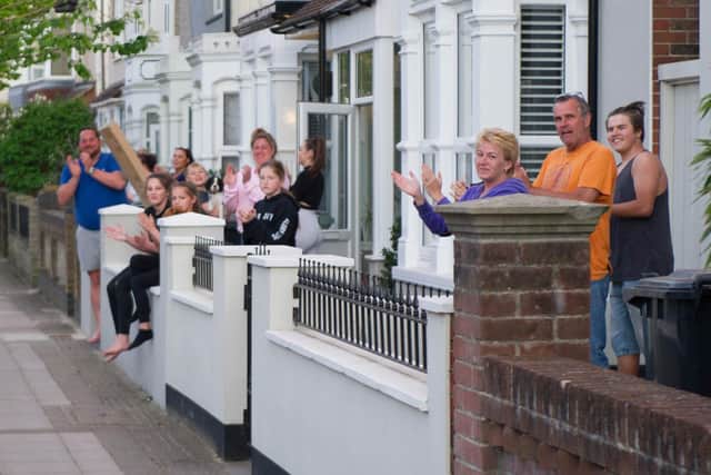 Residents outside their homes in Battenburg Avenue, Portsmouth, clapping for carers on April 14, 2020.
Picture: Habibur Rahman