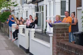 Residents outside their homes in Battenburg Avenue, Portsmouth, clapping for carers on April 14, 2020.
Picture: Habibur Rahman