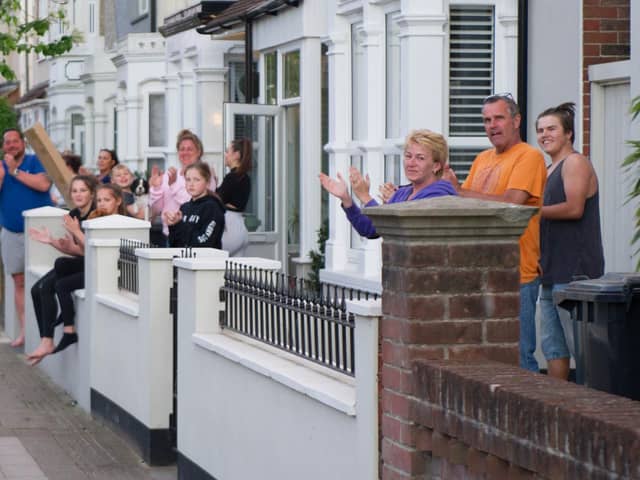 Residents outside their homes in Battenburg Avenue, Portsmouth, clapping for carers on April 14, 2020.
Picture: Habibur Rahman