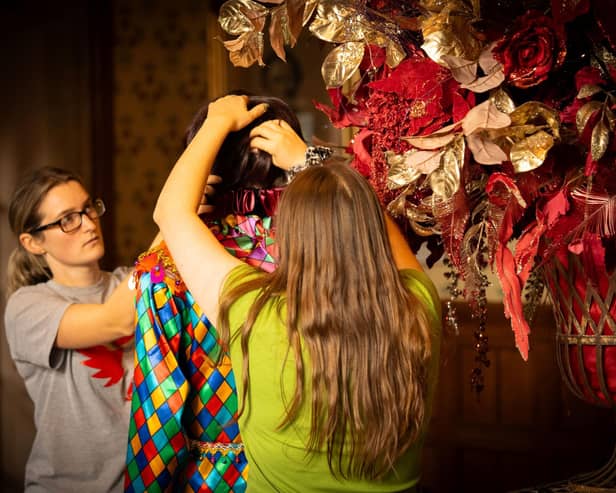 Decorating begins on one of the masked harlequins for A Palace House Christmas