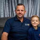 John Hoskin performed CPR on an elderly woman after spotting her collapsed on the floor while picking his son, Harvey up from school.
Pictured:  John Hoskin at his home with his son, Harvey, eight, at their home in Crookhorn
Photo: Habibur Rahman