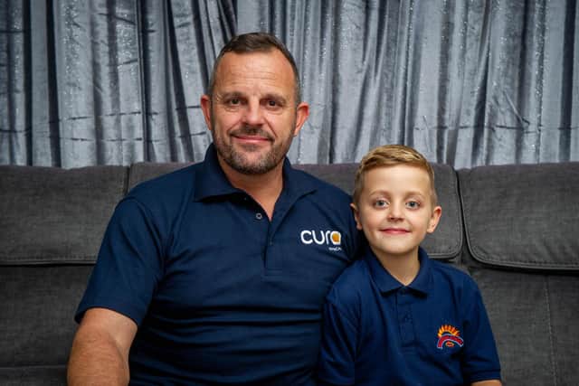 John Hoskin performed CPR on an elderly woman after spotting her collapsed on the floor while picking his son, Harvey up from school.
Pictured:  John Hoskin at his home with his son, Harvey, eight, at their home in Crookhorn
Photo: Habibur Rahman