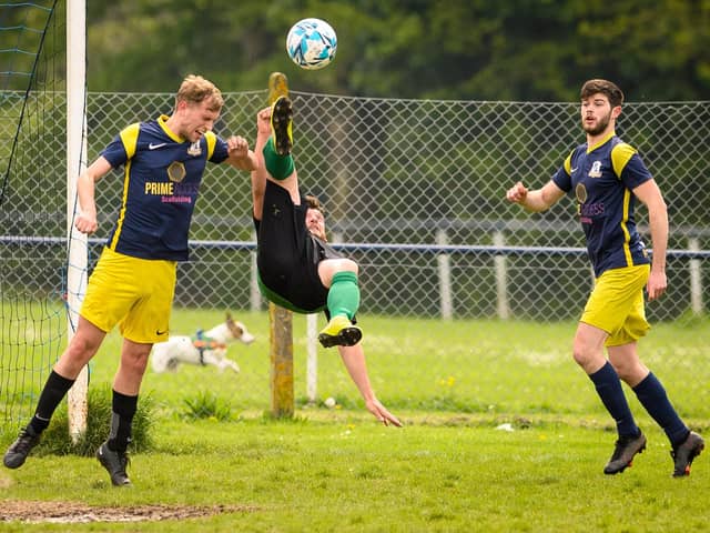 Action from Saturn Royale's 1-0 win over Pelham Arms (blue and yellow) in the Adelaide Cup semi-final. Picture: Keith Woodland