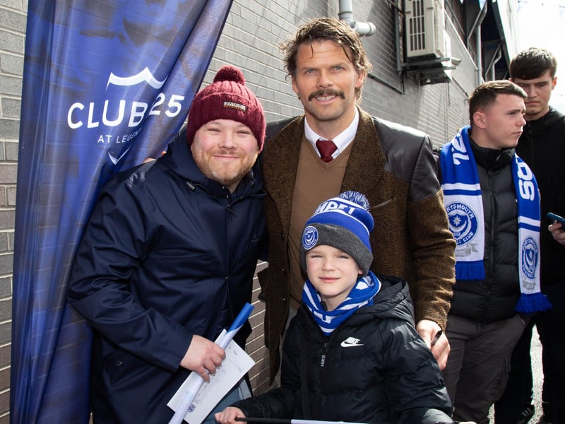The Hermannator, Hermann Hreidarsson, poses with fans ahead of the game.