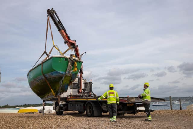 Pictured - Abandoned boats being removed by Langstone Harbour Board, as part of a separate operation, along with boats whose owners have agreed to scrap. Photos By Alex Shute
