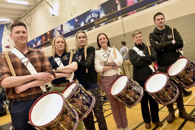 Pictured is: From the Royal Marines Corps of Drums (l-r) James Trowbridge, Kim Hare, Iron Maiden's drummer Nicko McBrain, Hayley Holgate, Steph Greening and Kyle Porter.