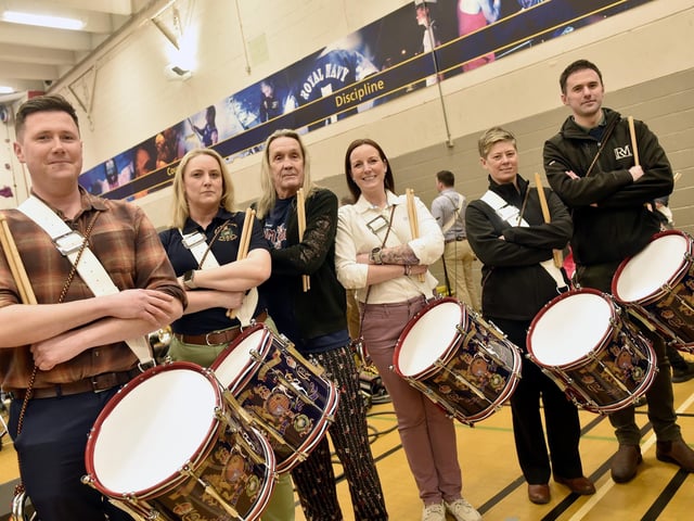 Pictured is: From the Royal Marines Corps of Drums (l-r) James Trowbridge, Kim Hare, Iron Maiden's drummer Nicko McBrain, Hayley Holgate, Steph Greening and Kyle Porter.