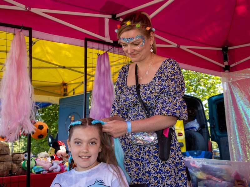 Pictured - Amy Parton, 8 having her hair braided. Photos by Alex Shute