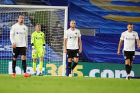Pompey's Jack Whatmough and Portsmouth's Craig MacGillivray are dejected after another Brighton goal in the 4-0 Carabao Cup defeat. Picture: Joe Pepler