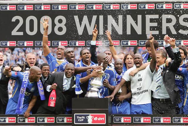 Pompey's jubilant 2008 FA Cup winning team, with Sean Davis (far left) just making the photo. Picture: Carl De Souza/AFP via Getty Images)