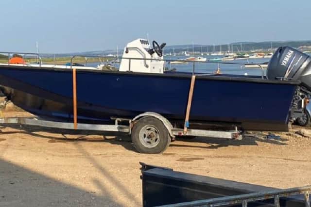 The blue and cream boat with twin outboard engines was stolen at Keyhaven, in Lymington. Picture: Hampshire and Isle of Wight Constabulary.