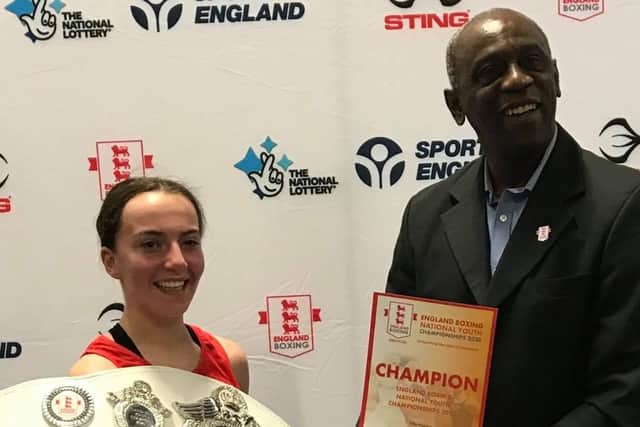 Tilly Hymers (left) with her England Youth Championships belt