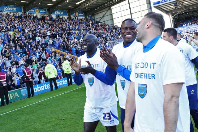 Patrick Agyemang, Bondz N'Gala and Ricky Holmes applaud the Fratton faithful after the final match of the 2013-14 season. Picture: Joe Pepler