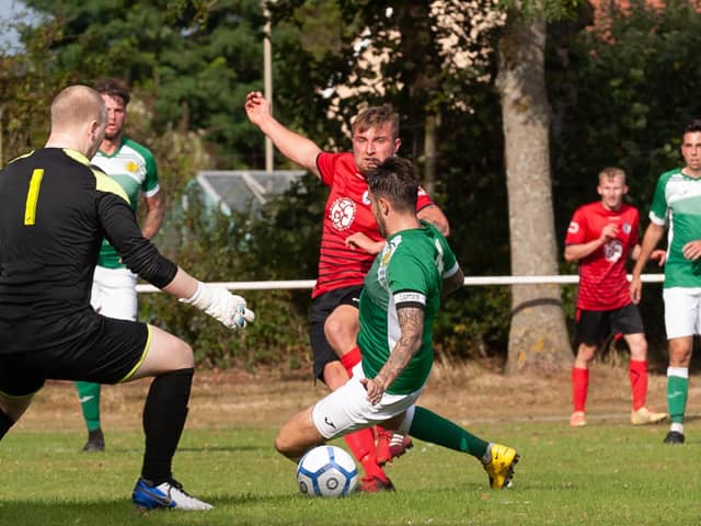 Ryan Bath (red) has scored 23 league and cup goals in as many appearances for Locks Heath this season. Picture: Keith Woodland