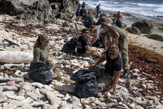 Crew of RFA Argus clean a beach on Curacao to help save the lives of endangered sea turtles. Photos: Royal Navy
