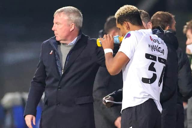 Kenny Jackett, left, and Haji Mnoga. Picture: Nigel Keene