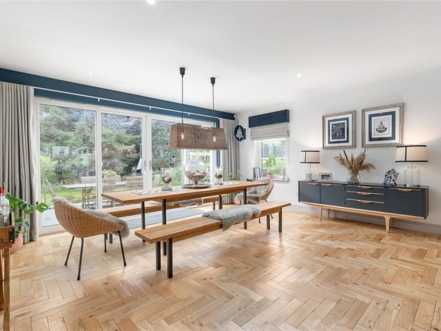 The dining area includes doors which open into the garden.