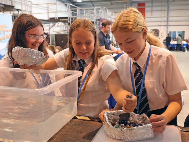 Year 7 pupils from Fareham Academy test out their tin foil boats at SULSTEMIC