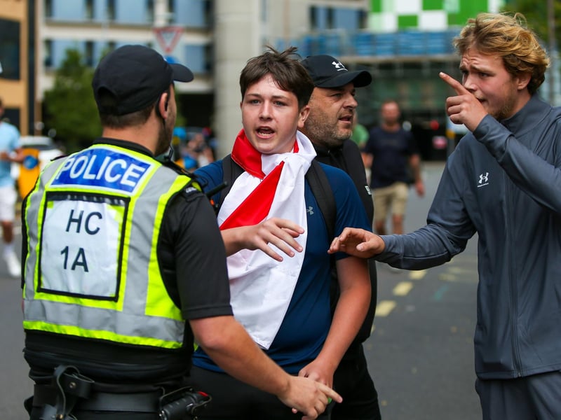Protestors at Guildhall Square, Portsmouth. Demonstrators having verbal exchanges with officers. Picture: Chris  Moorhouse (030824-53)