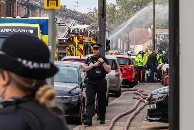 Paramedics attending to a casualty from an explosion in Nelson Avenue. Picture: Mike Cooter (221021)