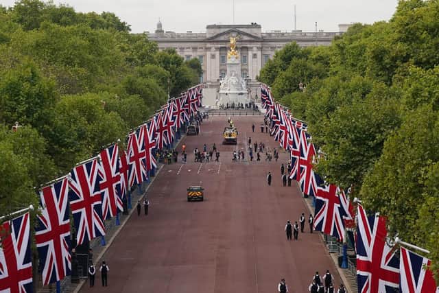 Crowds gather along The Mall ahead of the ceremonial procession of the coffin of Queen Elizabeth II from Buckingham Palace to Westminster Hall, London. Picture date: Wednesday September 14, 2022. Picture: Victoria Jones/PA Wire.