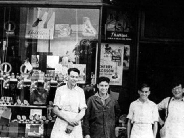 J H Bowers and Son repairers shop Dennis, third from the right, as a boy outside his late father's shop in Old Fawcett Road. To the right is his father and far left two brothers, Roy and Eric.