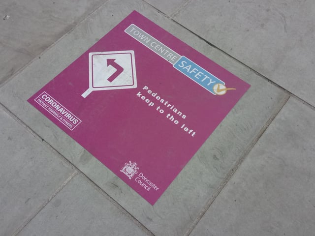 Signs are in place to keep drinkers apart.