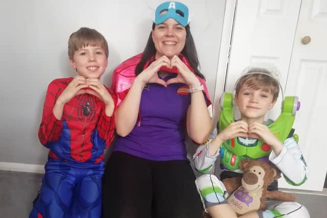 Kidslingo teacher, Becky Burningham  with two of her students.