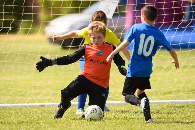 Action from the Clanfield youth football tournament at Horndean Technology College. Picture: Keith Woodland (270521-271)