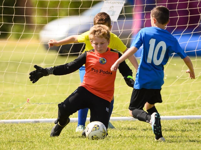 Action from the Clanfield youth football tournament at Horndean Technology College. Picture: Keith Woodland (270521-271)