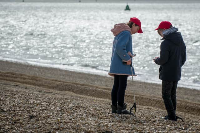 Chernobyl children are litter picking on Southsea beach opposite Clarence Pier on 17 March 2020.

Pictured: Ivanna 11 and Serhiy 11 picking up litter.

Picture: Habibur Rahman