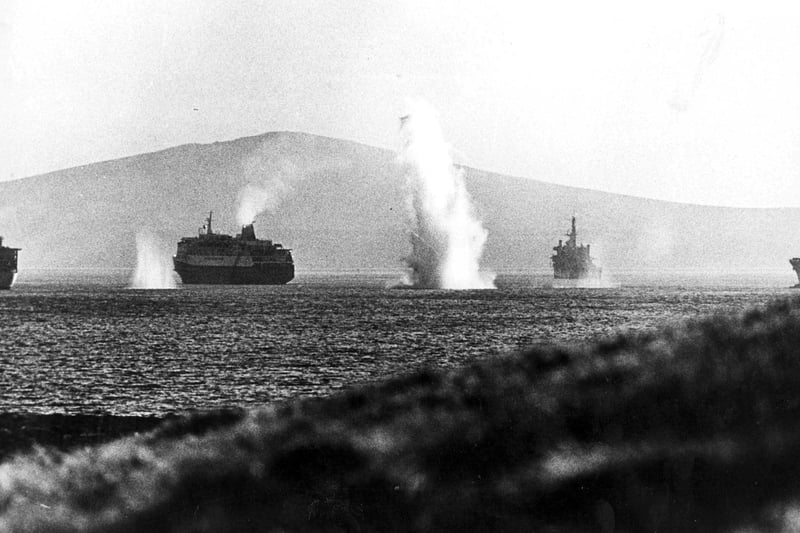 Bombs rain down on RFA Olna, MV Norland, HMS Intrepid and Fort Austen, in Bomb Alley. The News archvie