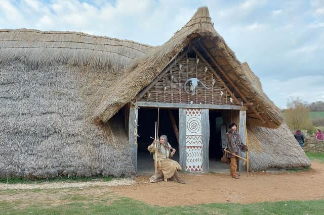 Butser Ancient Farm's reconstruction of a stone age building, Horton House, unveiled, April 2021. From left: Jo Shorter, William Scanlan. 
Picture by Chris Broom