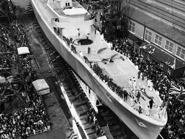 Hundreds of spectators watch the launch of HMS Andromeda in Portsmouth Dockyard in May 1967