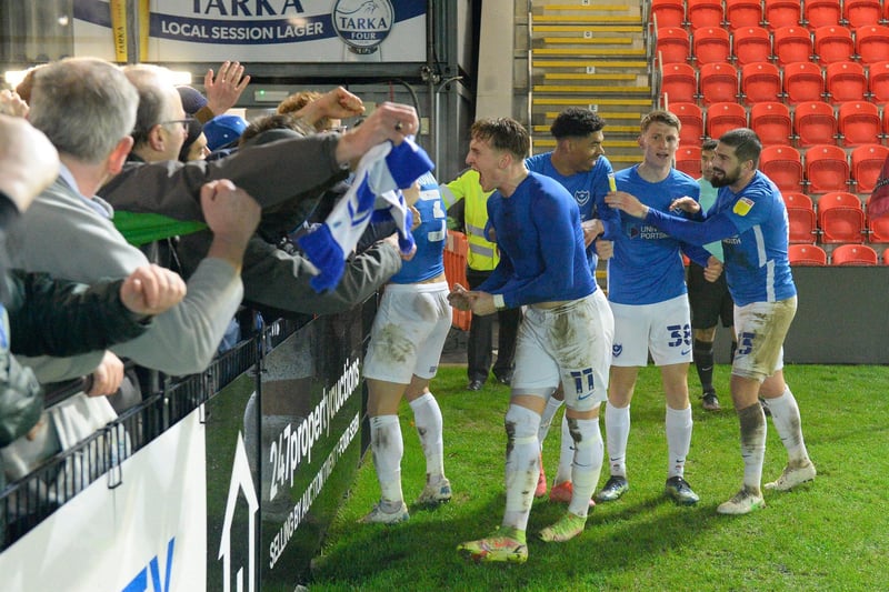 Ronan Curtis celebrates with the travelling Pompey fans following his double in the 3-2 Papa John's Trophy win at Exeter