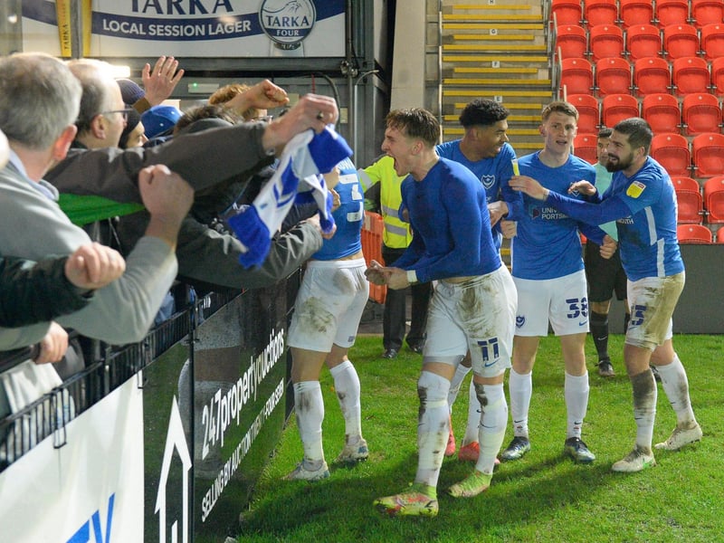 Ronan Curtis celebrates with the travelling Pompey fans following his double in the 3-2 Papa John's Trophy win at Exeter