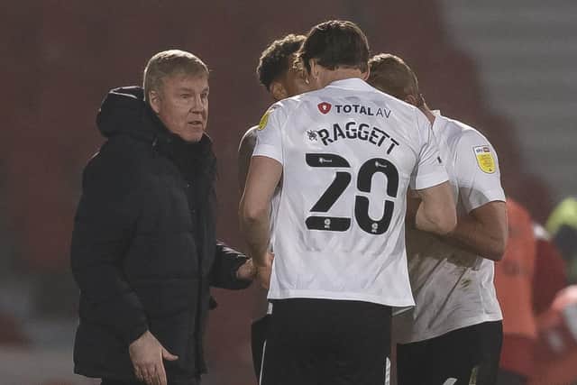 Kenny Jackett speaks to his Pompey players during the 2-1 loss at Doncaster. Picture: Daniel Chesterton