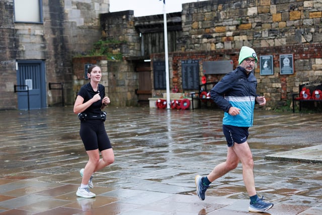 Runners hit the streets in wet and windy conditions despite The Great South Run being cancelled.