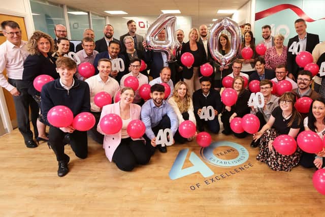 FOUR DECADES: Staff at HWB Chartered Accountants celebrate the firm’s 40th anniversary