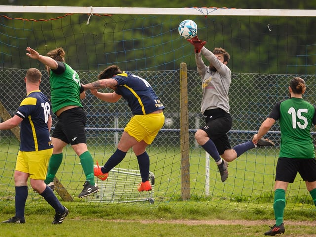 Action from Saturn Royale's 1-0 win over Pelham Arms (blue and yellow kit) in the second Adelaide Cup semi-final. Picture: Keith Woodland (300421-360)