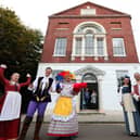 The cast of the 2021 Groundlings Theatre panto Beauty and The Beast celebrate at the official opening of the building's restored frontage in October 2021. Picture: Chris Moorhouse