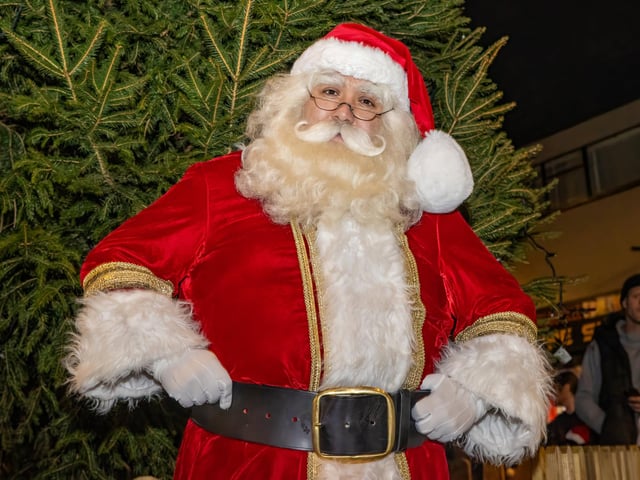 Santa gets ready to turn on the Christmas lights. Photos by Alex Shute