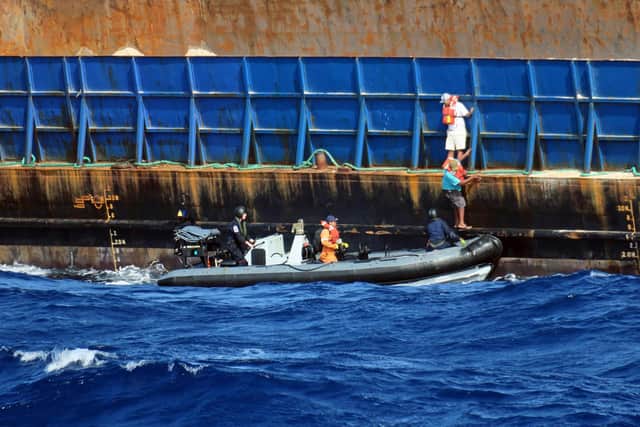 HMS Medway rescuing the crew of an ocean-going tug which started sinking off Anguilla in the Caribbean Picture: Able Seaman Mitchell 'Jack' Macguire/Royal Navy/PA Wire